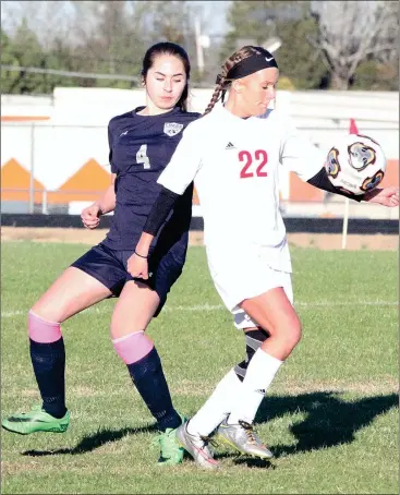  ??  ?? LFO’s Chelsey Lindsey looks to keep the ball away from Coahulla Creek’s Betsy Rendon during last week’s match in Fort Oglethorpe. The Warriors and Lady Warriors will face county rival Heritage at Hertage on Thursday, starting at 5 p.m. (Catoosa County...