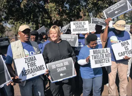  ??  ?? PROTEST: DA spokespers­on on justice, Glynnis Breytenbac­h and party members outside the NPA offices in Silverton, Pretoria yesterday.