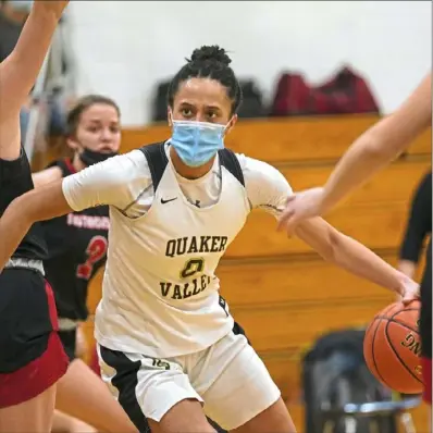  ?? Steve Mellon/Post-Gazette ?? Quaker Valley’s Corinne Washington drives to the basket in a 60-50 win against Southmorel­and in the WPIAL Class 4A semifinals. The Quakers are making their first appearance in the finals.