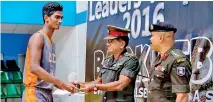  ??  ?? Chirath Matarage receiving the trophy for the Best Defensive Player