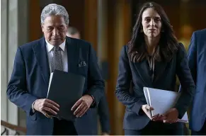  ?? GETTY IMAGES ?? Deputy Prime Minister Winston Peters and Prime Minister Jacinda Ardern are at odds over when to move alert levels.