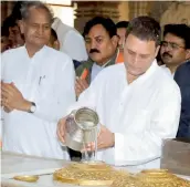  ?? — PTI ?? Congress vice- president Rahul Gandhi ( above) offers prayers at the Somnath Temple in Gujarat on Wednesday. Prime Minister Narendra Modi waves to the crowd during a rally at Morbi on Wednesday.