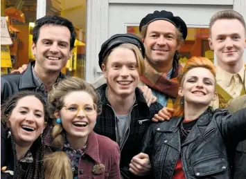  ?? Nicola Dove / CBS Films ?? Karina Fernandez (far left), Andrew Scott, Jessie Cave, Freddie Fox, Dominic West, Faye Marsay and Joshua Hill in “Pride.”