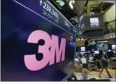  ?? RICHARD DREW — THE ASSOCIATED PRESS ?? The logo for 3M appears on a screen above the trading floor of the New York Stock Exchange on Tuesday.