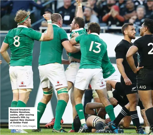  ?? PICTURES: Getty Images ?? Record-breakers: Robbie Henshaw, centre, after scoring Ireland’s fifth try against New Zealand at Soldier Field