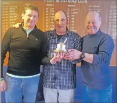  ??  ?? Captain Wolfi Kroner presents the Tor Alvey trophy to winners Kevin McAleney and Ronnie Mann.