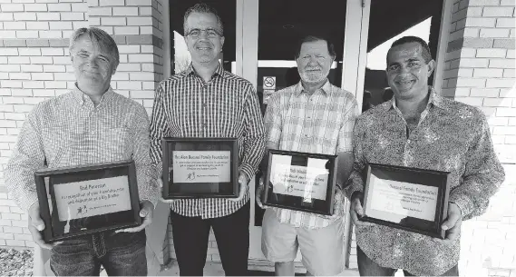  ?? TYLER BROWNBRIDG­E ?? Rod Peturson, left, Rick Quesnel, Kirk Windibank and Al Quesnel smile after the Quesnels donated $200,000 to Big Brothers Big Sisters of Windsor Essex County in 2015. When they were boys, Peturson was Rick’s Big Brother and Windibank was Al’s.