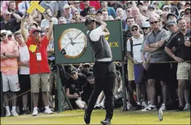  ?? Peter Morrison The Associated Press ?? Tiger Woods surged into contention Saturday with a 66, his lowest round on the weekend at a major in eight years, at the British Open in Carnoustie, Scotland.