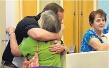  ?? MARLA BROSE/JOURNAL ?? Marian Herrera, mother of Marc Herrera, hugs Scott Ogledzinsk­i, Marc’s freshman roommate at the Air Force Academy, after Amy Herrera was found not guilty in Marc Herrera’s 2012 death.