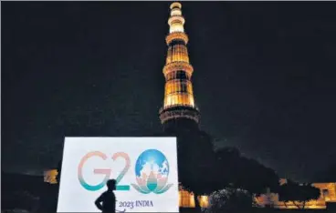  ?? SANCHIT KHANNA/HT PHOTO ?? The G20 logo displayed near the Qutub Minar on Thursday to mark the occasion.