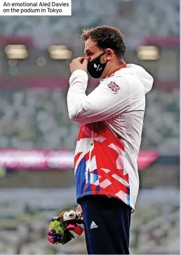  ??  ?? An emotional Aled Davies on the podium in Tokyo