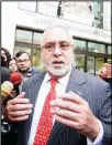  ??  ?? Indian businessma­n Vijay Mallya speaks to the media as he leaves Westminste­r Magistrate­s Court inLondon on Dec 10. (AP)