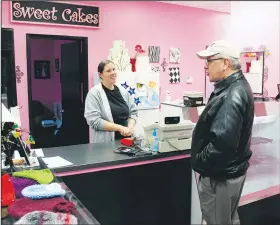  ?? AP File Photo ?? Melissa Klein, co-owner of Sweet Cakes by Melissa, tells a customer that the bakery has sold out of baked goods for the day Feb. 5, 2013, in Gresham, Ore.