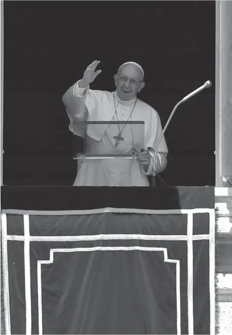  ??  ?? Pope Francis blesses the crowd as he recites the Angelus noon prayer from the window of his studio overlookin­g St. Peter's Square, at the Vatican, Sunday, July 8, 2018. (AP)