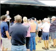  ?? Lynn Atkins/The Weekly Vista ?? General Manager Tom Judson stands on a bench outside the Branchwood Clubhouse to address about 150 members who were waiting for a tour of the facility. Another tour is scheduled for Aug. 28, and the building should open in September.