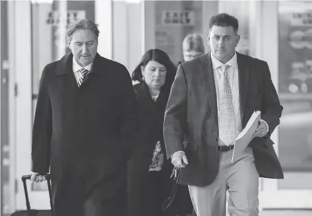  ?? GEOFF ROBINS/THE CANADIAN PRESS ?? Former gymnastics coach Dave Brubaker, right, leaves the courthouse with his lawyer Patrick Ducharme in Sarnia following the first day of testimony in Brubaker’s sexual assault trial.