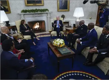  ?? SUSAN WALSH — THE ASSOCIATED PRESS ?? President Joe Biden and Vice President Kamala Harris meet with members of the Congressio­nal Black Caucus in the Oval Office of the White House in Washington on Thursday. From left are Rep. Joe Neguse, D-colo., Rep. Sheila Jackson Lee, D-texas, Sen. Cory Booker, D-N.J.,, Rep. James Clyburn, D-S.C.,SEN. Raphael Warnock, D-GA., and caucus chair Rep. Steven Horsford, D-nev.