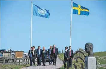  ?? AFP ?? UN Secretary-General Antonio Guterres (centre) arrives for the annual informal working meeting with the UN Security Council at Dag Hammarskjo­ld’s farm at Backakra yesterday.