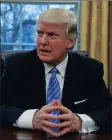  ??  ?? President Donald Trump sits in the Oval Office. He added fuel to fire recently with his travel ban on Muslim majority countries.