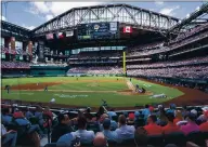  ?? JEFFREY MCWHORTER — THE ASSOCIATED PRESS ?? Fans fill the stands to capacity at Globe Life Field during the home opener between the Rangers and Blue Jays on Monday.