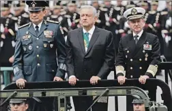  ?? Marco Ugarte Associated Press ?? PRESIDENT Andrés Manuel López Obrador, f lanked in 2019 by the defense and navy secretarie­s, has embraced the armed forces he once condemned.