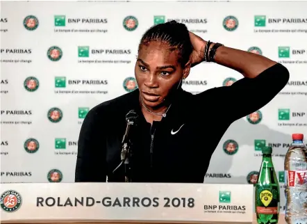  ?? AP ?? A disappoint­ed Serena Williams fronts the media to explain her reasons for pulling out of her French Open fourth round match against Maria Sharapova.