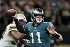  ?? THE ASSOCIATED PRESS FILE ?? Eagles quarterbac­k Carson Wentz looks to throw a pass last week against the New Orleans Saints. He didn’t complete enough in a 48-7 loss.