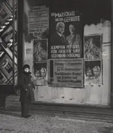  ??  ?? Above: Vishniac’s daughter, Mara, posing in front of an election poster for Hindenburg and Hitler that reads ‘The Marshal and the Corporal: Fight with Us for Peace and Equal Rights’, Wilmersdor­f, Berlin, 1933