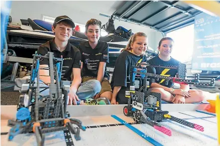  ?? SIMON O’CONNOR/STUFF ?? Tim Thykowalew­ski, 14, Conor Eager, 13, Riley Pollard, 11, and Tara Stevens, 14, will travel to America in April to pit their robots against 2000 others.