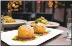  ??  ?? Rabbit arancini includes fried risotto stuffed with fontina cheese.