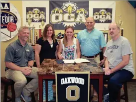  ??  ?? On hand at Oakwood Christian Academy to see Tori Hall sign on Wednesday was Lady Eagles’ coach Kraig Givens, Amanda and Luke Hall and Lady Bobcats’ coach David Stephenson. (Catoosa County News photo/Scott Herpst)