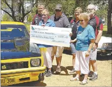  ??  ?? One community group helping another: Organisers of Dubbo’s monthly Cars and Coffee event granted a cheque for $7500 so that Make-a-wish can continue to grant wishes to children when they need them most.