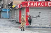  ?? AP ?? A curfew was imposed in Kashmir on Monday, a day after three Hizbul Mujahideen militants were gunned down by the forces.