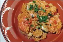  ?? BRENT DAVIS, RECORD STAFF ?? This version of seafood rice has clams, shrimp and scallops.