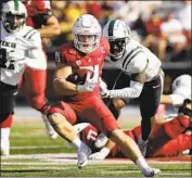  ?? Young Kwak Associated Press ?? MAX BORGHI is one of two running backs averaging over 5.5 yards per carry for Washington State.