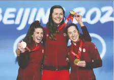  ?? ELSA/GETTY IMAGES FILES ?? Ivanie Blondin, Valerie Maltais and Isabelle Weidemann of Canada celebrate their gold medals in women's team pursuit at the Beijing 2022 Winter Olympic Games on Feb. 15.