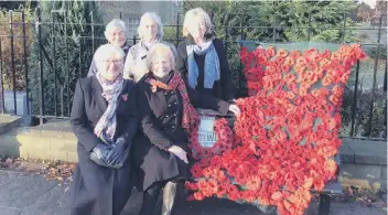  ??  ?? Members of Gilpin WI with their poppy tribute to the fallen.