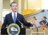  ?? NELVIN C. CEPEDA/THE SAN DIEGO UNION-TRIBUNE VIA AP ?? California Gov. Gavin Newsom meets with the media Friday to discuss legislatio­n that would allow for private citizens to enforce the state’s ban on assault weapons.