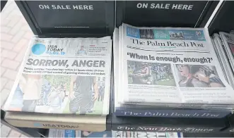  ?? GETTY IMAGES/AFP ?? USA Today, owned by Gannett Co, and The Palm Beach Post, owned by GateHouse Media Inc, are seen at a newsstand in Palm Beach, Florida on Monday.