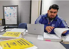  ?? Steve Gonzales / Houston Chronicle ?? Chavez High School administra­tor Roel Saldivar works on the school’s master schedule. Recently purchased software will automate scheduling at HISD’s 38 high schools, a process that now takes weeks of work.