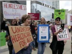  ?? CHARLES REX ARBOGAST — THE ASSOCIATED PRESS FILE ?? Protesters gather across the Chicago River from Trump Tower to rally against the repeal of the Affordable Care Act, in Chicago, in this file photo.