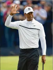  ?? STUART FRANKLIN/GETTY IMAGES ?? Tiger Woods celebrates a birdie on the sixth hole during the second round of the Open Championsh­ip on Friday. The rest of his round left something to be desired, however, as he missed the cut.