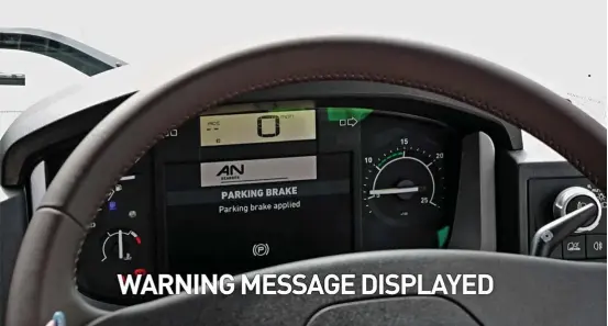  ??  ?? ⇧ ‘Parking Brake Applied’ warning message is displayed in the dashboard.