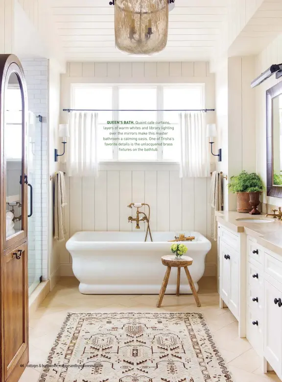  ??  ?? QUEEN’S BATH. Quaint cafe curtains, layers of warm whites and library lighting
over the mirrors make this master bathroom a calming oasis. One of Trisha’s favorite details is the unlacquere­d brass
fixtures on the bathtub.