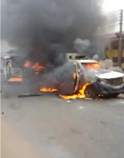  ?? PHOTOS: ?? Police vehicles were burnt in the protest. Usman A. Bello