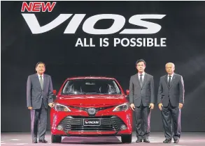  ??  ?? From left: Mr Kyoichi with Vudhigorn Suriyachan­tananont, executive vice president, and Mr Suparat at the launch of “New VIOS”. Mr Kyoichi remains committed to bringing new HEV models to the Thai market.