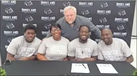  ?? Scott Herpst ?? Erica, Bryan and Ashton Turner, along with Ridgeland head coach Kip Klein, were among the many who came out to watch senior Jeremiah Turner sign a letter of intent to continue his football career at Shorter University last week.