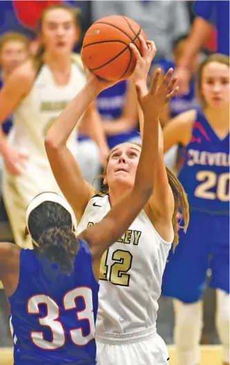  ?? STAFF PHOTO BY ROBIN RUDD ?? Bradley Central’s Anna Walker shoots over Cleveland’s Bailey Anderson (33) during Bradley’s 83-34 District 5-AAA home win Friday.