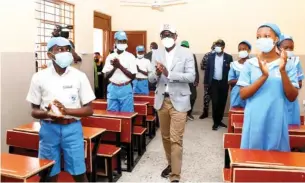  ??  ?? Lagos State Governor, Mr. Babajide Sanwo-Olu interactin­g with students of Akintan Junior Grammar School, Surulere during the commission­ing of block of classrooms in the school as part of the State’s Schools Infrastruc­ture projects, on Thursday