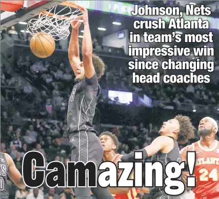  ?? Robert Sabo ?? COMING-OUT PARTY: Nets forward Cam Johnson dunks in the final seconds of the first quarter on his way to a season-high 29 points as the Nets went on to blow out the Hawks, 124-97, Thursday night at Barclays Center.